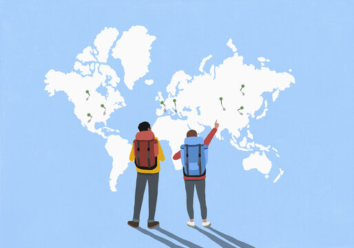 Couple with backpacks looking and pointing at location pins on global map