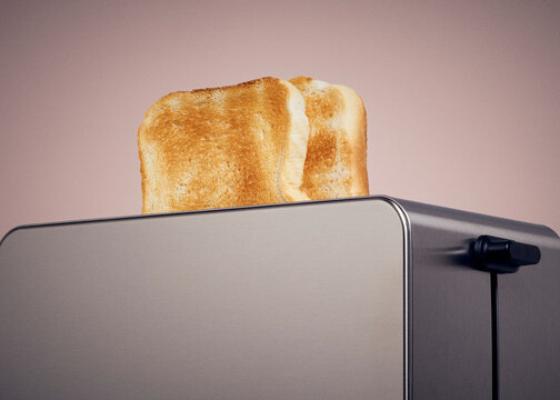 Toasted white bread popping out of modern toaster against pink background