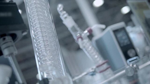 Laboratory mechanical mixers rotate fans in demo mode. Closeup. Follow focus