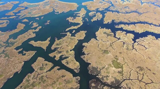 Aerial drone view of Dalyan delta labyrinth in Mugla Turkey with reeds, channels, and lagoon.