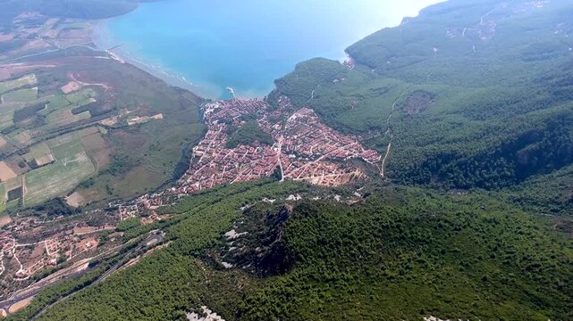 Aerial drone panorama of Akyaka Gokova in Mugla Turkey with delta plain, farms, forest, and sea.