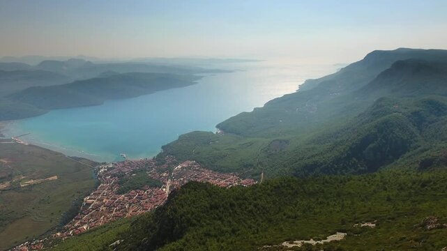 Aerial drone panorama of Akyaka Gokova in Mugla Turkey with delta plain, farms, forest, and sea.