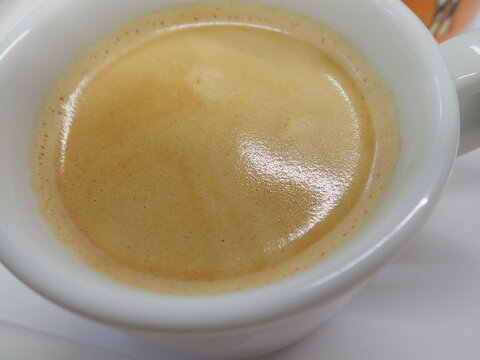 cup of fhresh caffee with cream