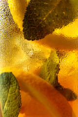 Naklejka premium Iced tea in a misted glass. Macro shot.