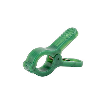 Green plastic plant clip for gardening, open with spring mechanism