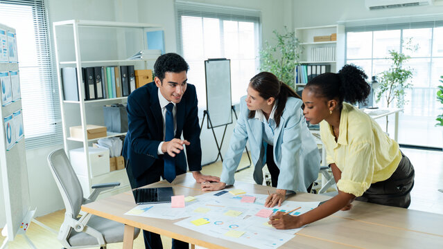 business people meeting and discussion in the office while working on a company project.Business teamwork and team doing corporate research in discussion together with technology in workplace