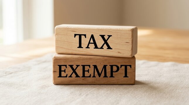 Tax Exempt Concept Written on Stacked Wooden Blocks for Financial and Legal Business Context