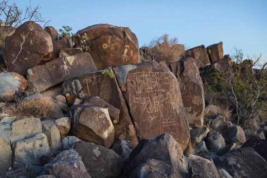 Petroglyphs carved into boulders
