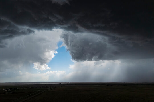 Rear flank downdraft storm cloud over fields near byers, colorado