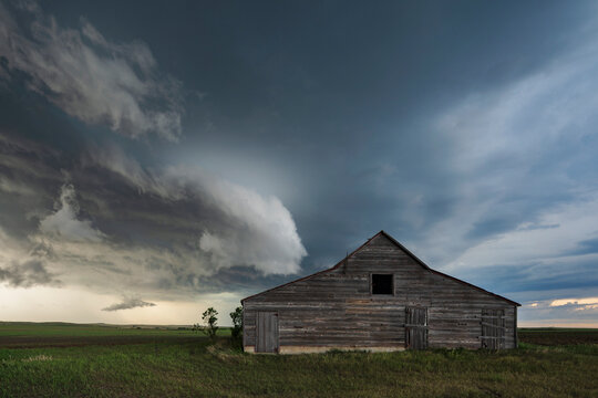 Old Barn under Storm Clouds in wood, south dakota