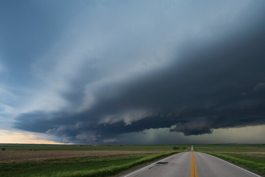 High Base Storm over open fields near wood, south dakota