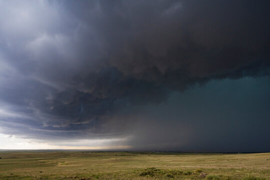 Storm clouds gathering over grassy plains in agate, colorado