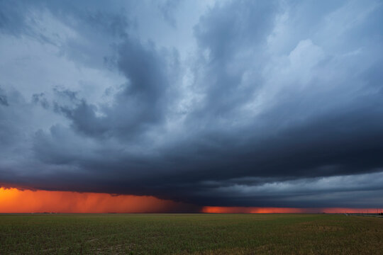 Supercell thunderstorm at Sunset over farmland in burlington colorado