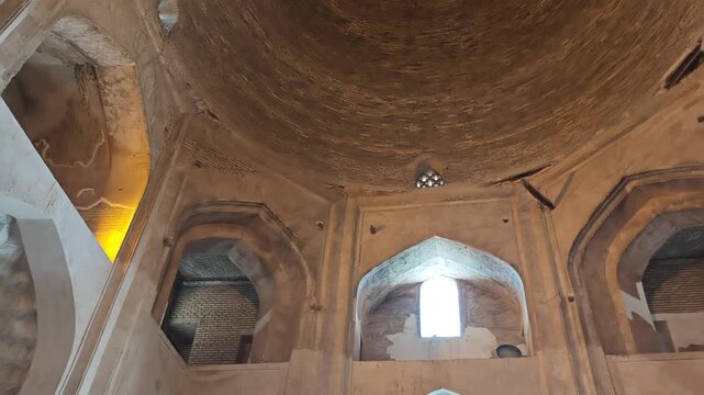 Interior of Haruniyeh Dome reveals vaulted brick architecture beneath a large historic cupola.