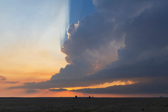 Storm cloud with crepuscular rays at Sunset near grover colorado