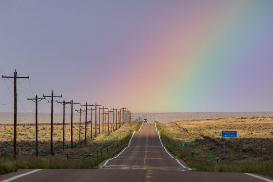 Highway 10 with rainbow near rocky ford colorado USA
