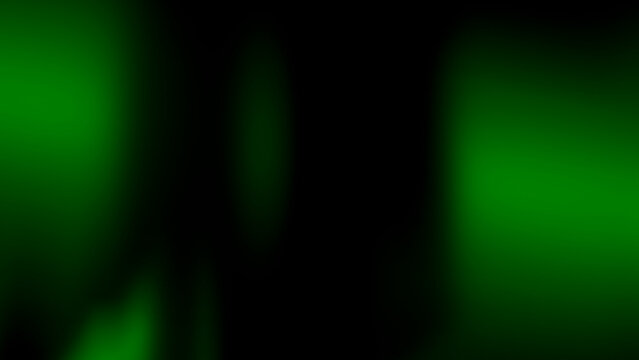 Green glowing bokeh lights on dark background