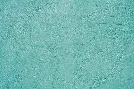 Teal leather texture background with subtle wrinkles