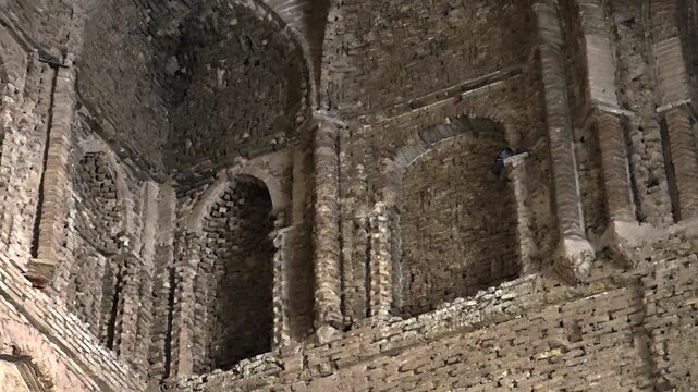 Stonework inside Nizam al Mulk Dome shows old masonry and historic architectural craft.