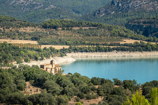Iglesia de Mipanas is a Romanesque-Gothic style church sitting on the banks of the El Grado reservoir in the Aragon region of Spain