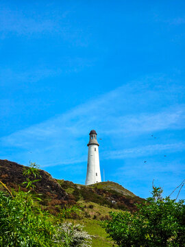 Sir John Barrow Monument, a landmark tower located on Hoad Hill above the town of Ulverston in Cumbria, England. It looks like a lighthouse but it not