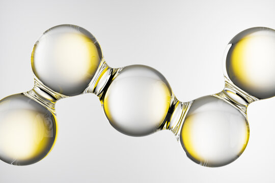 Abstract molecular structure with glossy transparent spheres and yellow oil color. 3D scientific background for chemistry, beauty, medicine, skincare, cosmetics, pharmaceuticals and research.