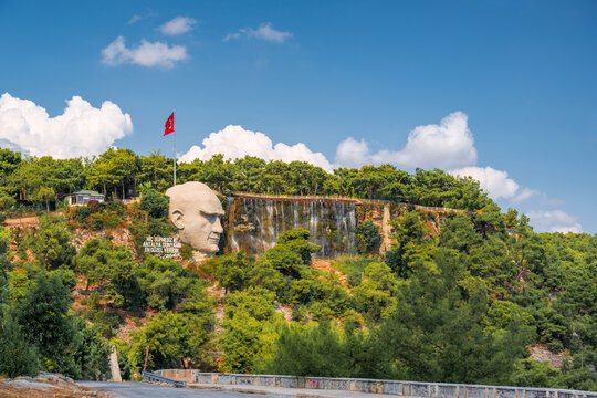 Ataturk Mask and artificial waterfall surrounded by forest in Kepez, Antalya, Turkey