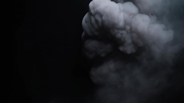 Billowing gray smoke swirls upward against a black background. Film title sequences, horror and suspense productions, and industrial presentations.