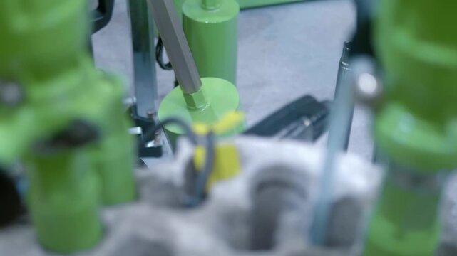 Samples of new diamond core drills of various diameters for concrete are presented at the exhibition. Closeup. Shot in motion. Follow focus