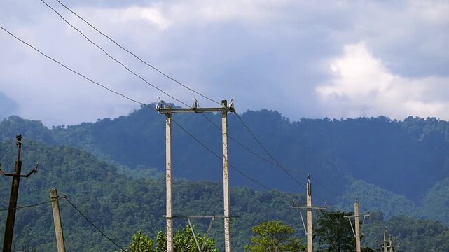 Mountain Landscape with Power Lines and Cloudy Sky