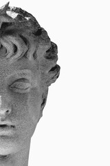 Half face of Aphrodite, ancient Greek goddess of love and beauty, isolated on white background with large copy space. © zwiebackesser
