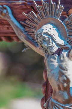 Close-up of Jesus Christ crucified on the cross, Christian religious symbol of sacrifice, suffering, salvation and faith.