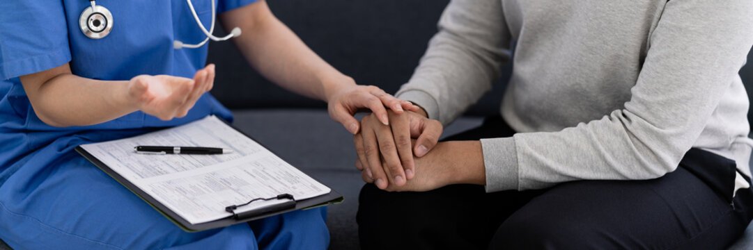 Doctor comforting taking care of the patient by hold hand
