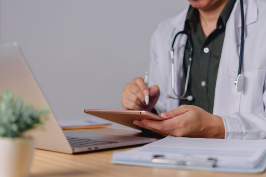 Doctor Using Tablet for Digital Healthcare Workflow