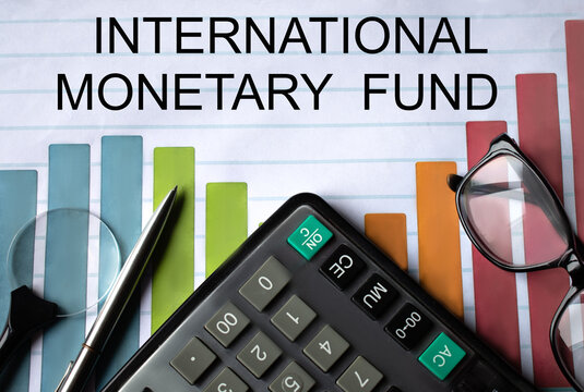 INTERNATIONAL MONETARY FUND - words on a color chart with a calculator, magnifying glass and glasses