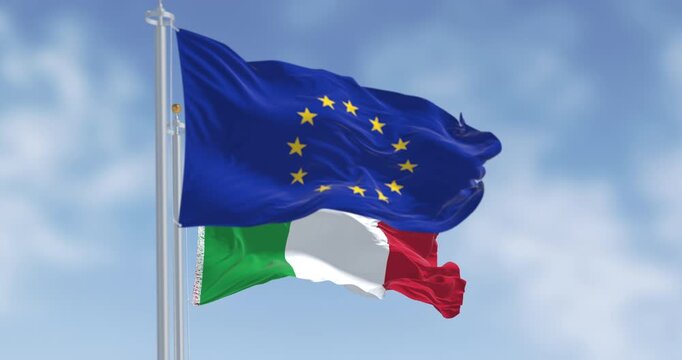 Italy and European Union flags waving on a clear day