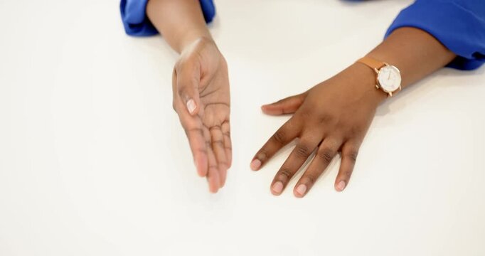 Close up of people talking to the camera, gesturing with hands at desk