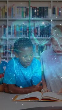 Vertical video: Kids leaning at open book, child pointing causing holo globe for learning, smiling
