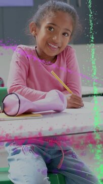 Vertical video: Child student writing with pencil at school particles sweeping pausing and resuming