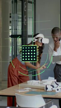 Vertical video: Woman with VR reaching over model, creating AR grid and rings for design review