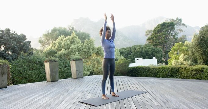 Lifestyle videos Outdoor of people doing activities, Practicing yoga on mat, woman balancing in tree