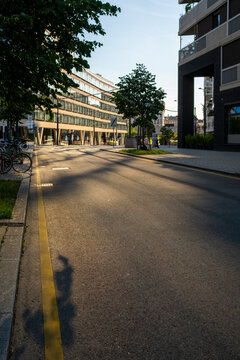 Street between modern buildings and trees in Nordbahnviertel, Vienna, Austria, showing residential urban architecture along the modern street and buildings