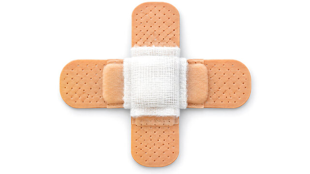 Cross shaped bandage isolated on white background, symbolizing medical care, injury treatment, and first aid