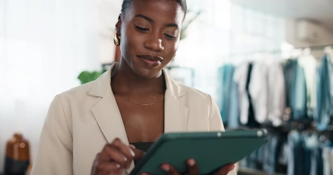 Fashion, tablet and happy woman in clothing shop for stock review, online sales or small business. Tech, black person or boutique entrepreneur with style update, scroll retail catalog or inventory