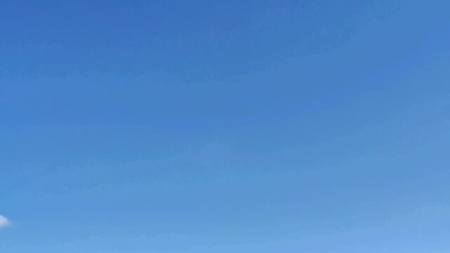 Clouds begins to appear in the cloudless sky