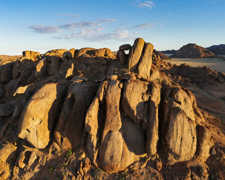 Balanced rock formation at sunrise in the bear at rock gardens Namibia