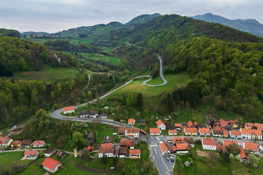 Winding road passing through village of Podsreda