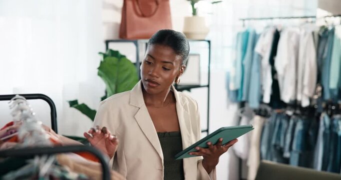Fashion, tablet or woman with clothing rack for stock, verify size or review in small business. Tech, black person or inventory management in boutique with sales check, retail style or update catalog