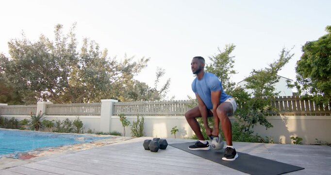Lifestyle videos outdoor of people doing activities, exercising outdoors, man lifting kettlebell on