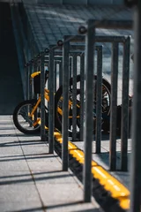 small kid bicycle parked and attached by chain tie, urban city view © goami